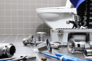 Plumber Tools And Equipment Fixing Toilet scaled 1 e1696334645628